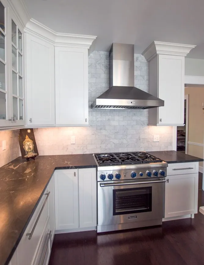 Kitchen remodel with stainless range hood and marble backsplash in Fairfield County, CT