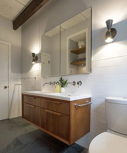 Floating wood vanity with wall-mounted faucet and medicine cabinet mirror, Craftworks Construction, Fairfield County CT