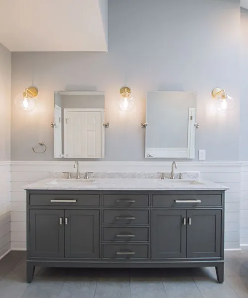 Double vanity bathroom remodel with charcoal cabinetry, marble countertop, and brushed nickel faucets, Craftworks Construction, Fairfield County CT