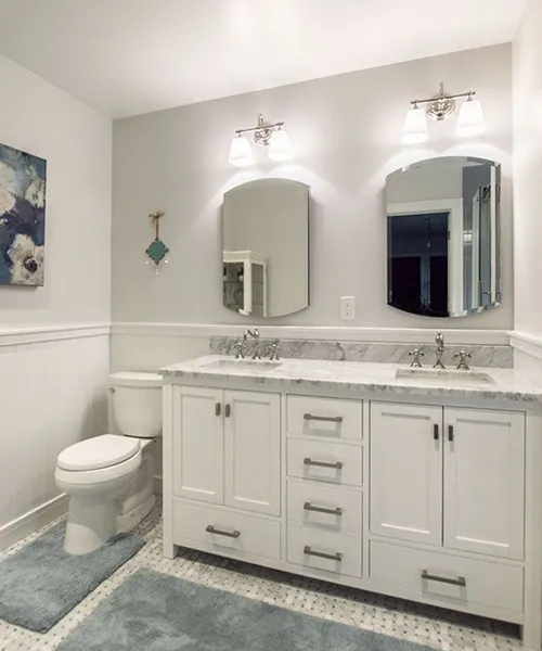 Double vanity bathroom remodel with white cabinetry and marble countertop, Craftworks Construction, Fairfield County CT